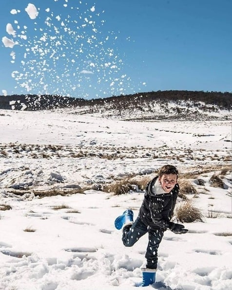 Child throwing snowball