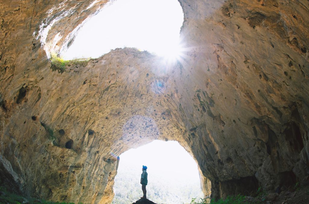 Woman enjoying a self-guided tour of Yarrangobilly Caves in Kosciuszko National Park, in the Snowy Valleys region of NSW.